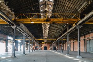 Old,And,Dusty,Warehouse,With,Light,Coming,Through,Openings